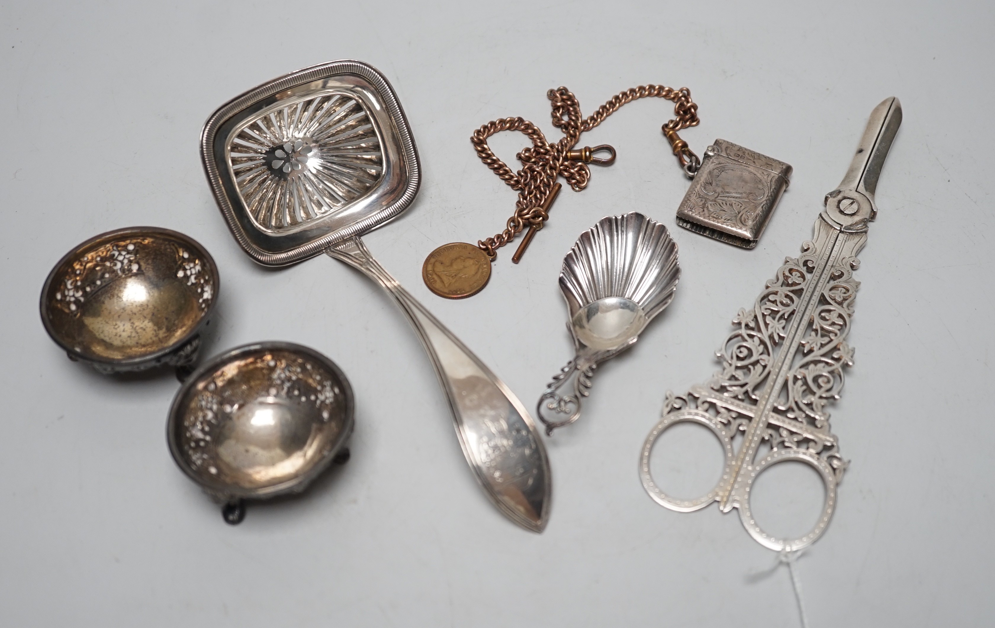 Sundry small silver including a pair of late Victorian grape shears, pair of Victorian salts caddy spoon and vesta case, together with a gilt metal albert chain and a Dutch white metal spoon.